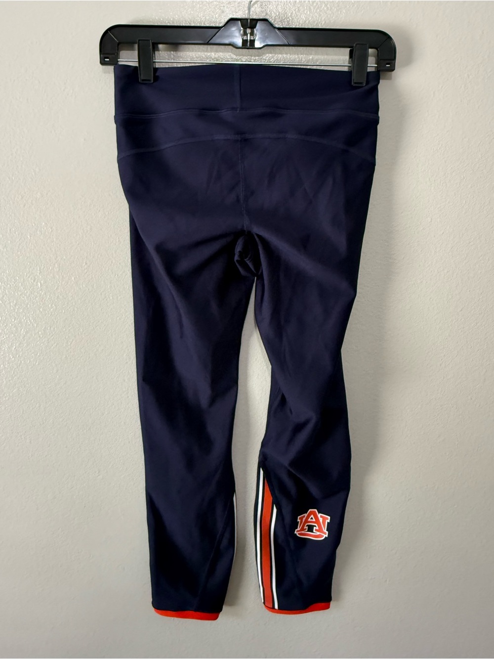 Auburn Under Armour team issued womens logo navy leggings. Size Small, preowned